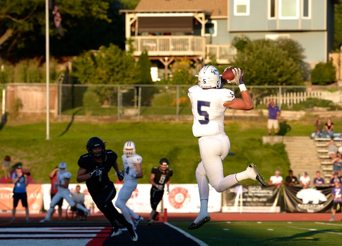 (Leah Hogsten  |  The Salt Lake Tribune) Lehi's Dallin Holker catches the touchdown pass in the first half. Holker caught two touchdown passes. Lehi High School leads Alta High School 42-28 during their game, Friday, August 18, 2017 in Sandy. 