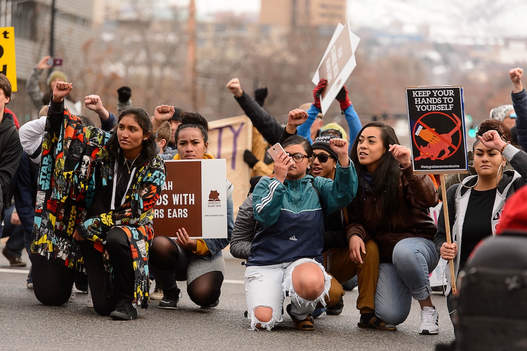 (Trent Nelson | The Salt Lake Tribune)  Protesters block off an intersection downtown after a rally against a visit by President Donald Trump, Monday December 4, 2017.