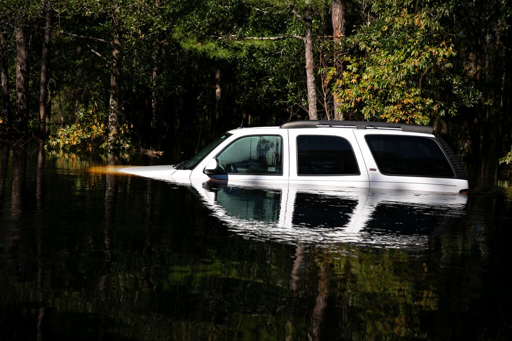 (Ilana Panich-Linsman | The New York Times)
A vehicle stranded in floodwaters in Ivanhoe, N.C., on Wednesday, Sept. 19, 2018. "They’re still cars. Technology can’t cure America of its addiction to the automobile," writes New York Times opinion columnist Farhad Manjoo.