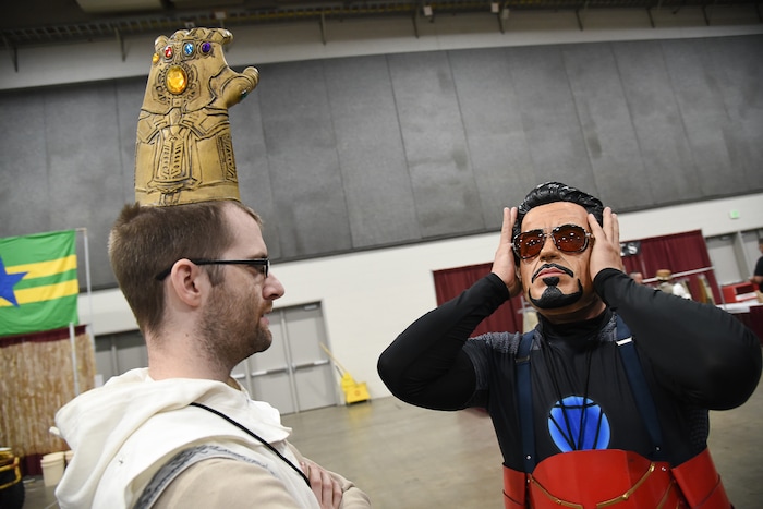 (Francisco Kjolseth  |  The Salt Lake Tribune)  Kyle Anderson, left, goofs off with a Infinity Gauntlet alongside T.J. DeCarlo as Tony Stark as they attend the start of FanX Salt Lake Comic Convention at the Salt Palace in Salt Lake City Thursday, Sept. 6, 2018, during the three-day pop culture convention.