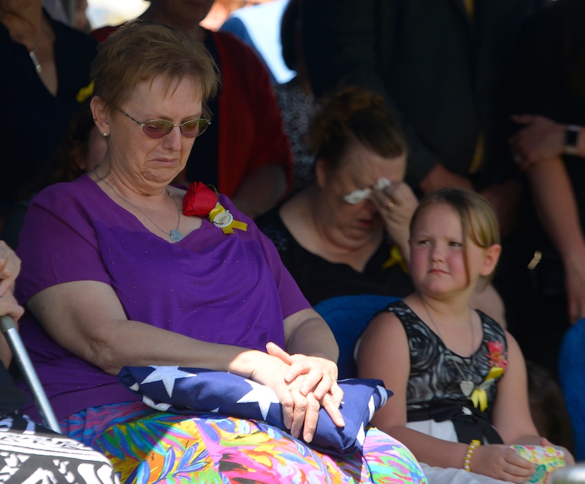 Leah Hogsten | The Salt Lake Tribune
Oakley Ricks looks at her grandmother Lorie Ricks, who sits at the gravesite of her husband, Utah Transit Authority electrician Kay Ricks, 63, Saturday, May 28, 2016, at Lehi City Cemetery. Kay Ricks served in the Navy and was a veteran of the Vietnam War, four years active duty and two years in the Naval Reserve, and eight years in the Utah National Guard. Two men kidnapped him from the UTA's Ballpark station in Salt Lake City, then killed him and left his body in rural Wyoming.