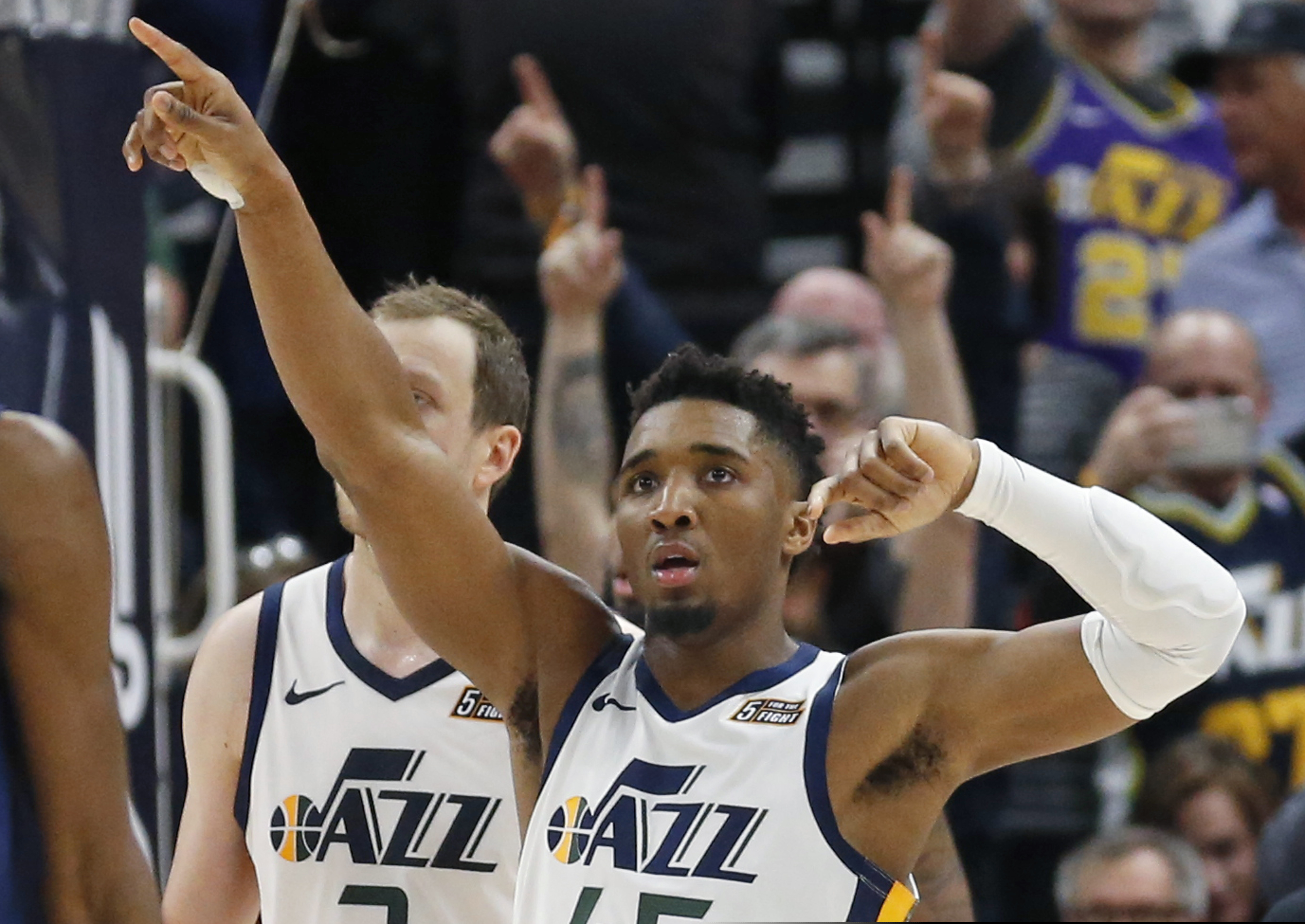 Utah Jazz guard Donovan Mitchell (45) celebrates as he walks up court during the second half of the team's NBA basketball game against the Minnesota Timberwolves on Friday, Jan. 25, 2019, in Salt Lake City. (AP Photo/Rick Bowmer)