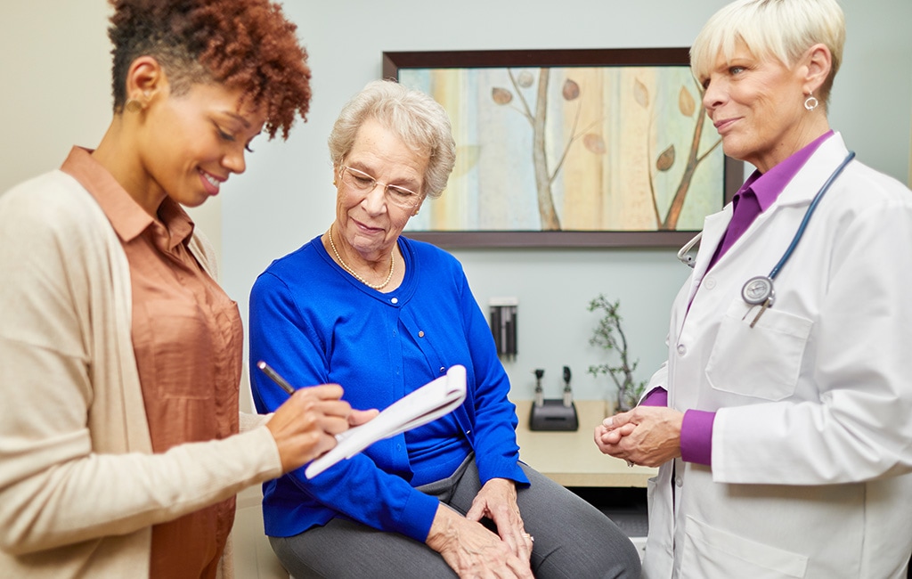 (Humana, sponsored) Senior talking with their primary care doctor.