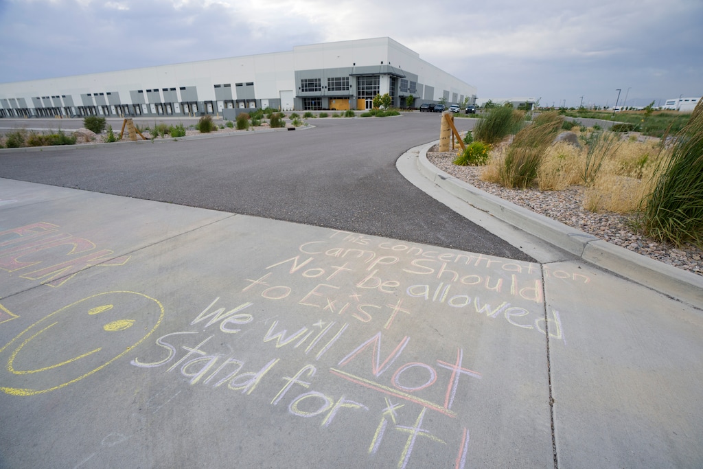 (Bethany Baker  |  The Salt Lake Tribune) Messages are written on the ground as people protest outside of an Immigration and Customs Enforcement detention center in Salt Lake City on Saturday, June 6, 2026.