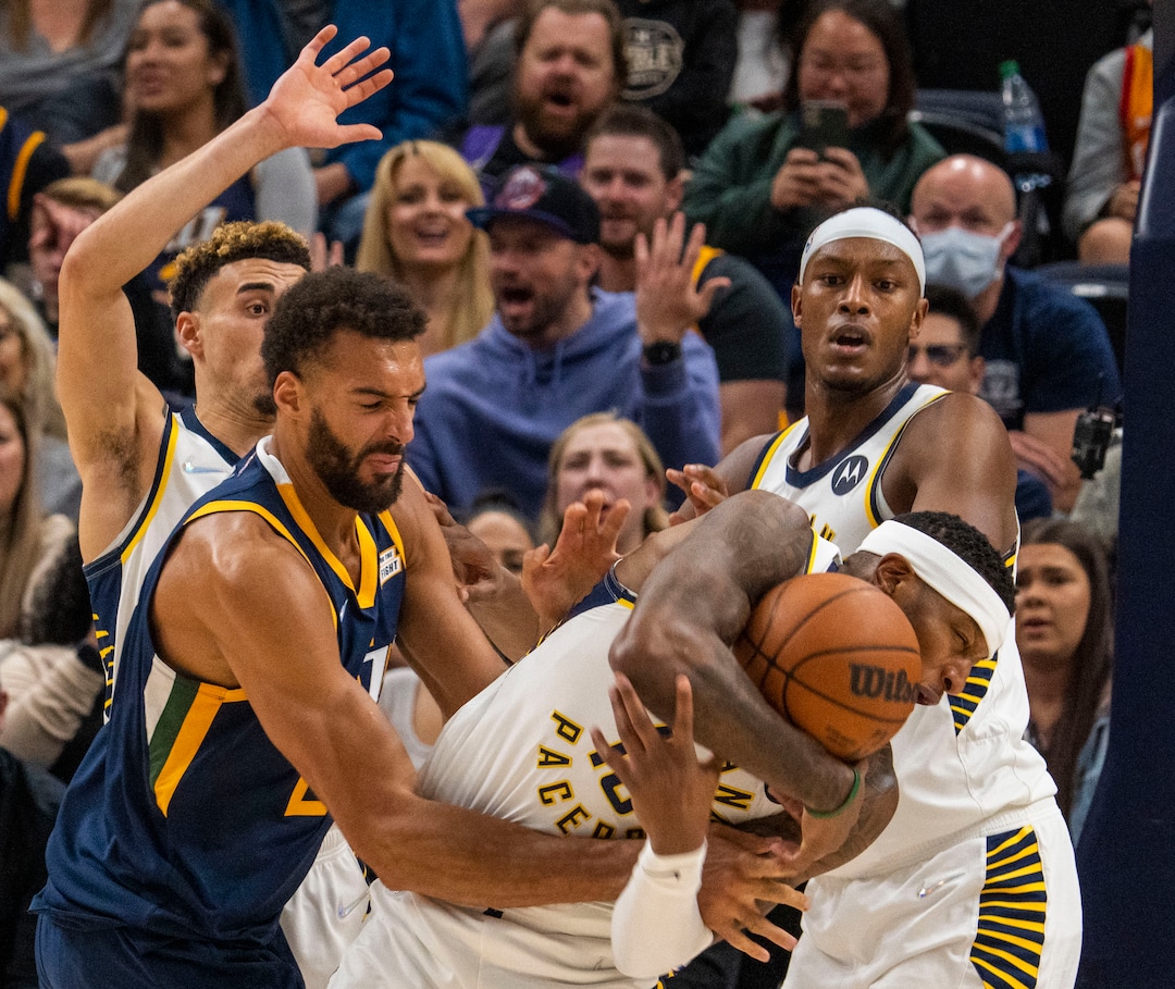 (Rick Egan | The Salt Lake Tribune) Utah Jazz center Rudy Gobert (27) goes for the ball along with Indiana Pacers forward Torrey Craig (13), in NBA action between the Utah Jazz and the Indiana Pacers at Vivint Arena, on Thursday, Nov. 11, 2021.