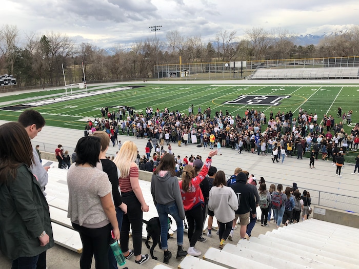 (Chris Detrick  |  The Salt Lake Tribune) Students at Highland High School in Salt Lake City gather on the football field to participate in a nationwide demonstration for better gun safety laws on March 14, 2018.