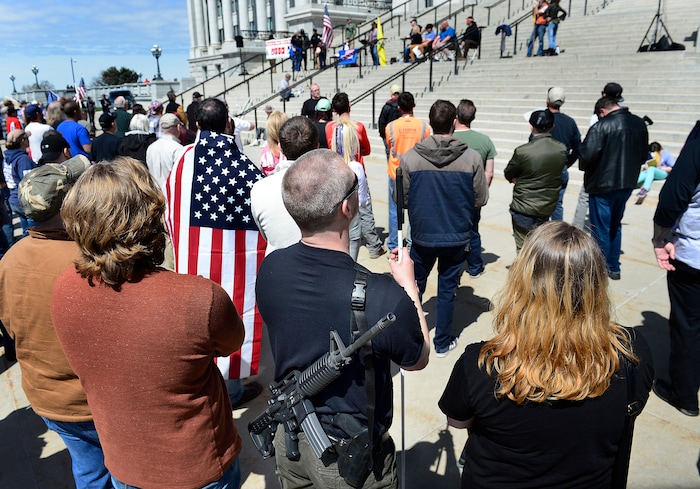 (Scott Sommerdorf | The Salt Lake Tribune)
A man carrying his weapon on his back and leaning on a white cane was part of a group calling themselves Citizens and Students For Liberty (SFL) as they gathered at the Utah State Capitol on Saturday to show their support for the Second Amendment, Saturday, April 14, 2018.