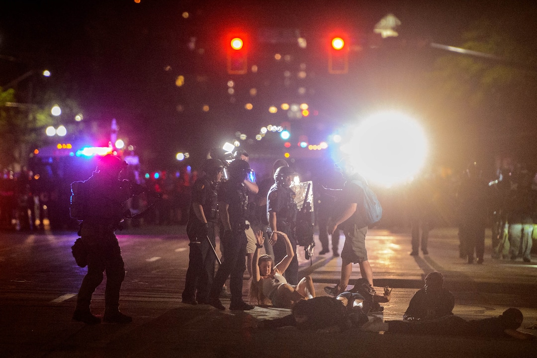 (Trent Nelson  |  The Salt Lake Tribune)  Police make arrests after a protest against police brutality turned violent in Salt Lake City on Saturday, May 30, 2020.