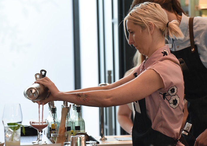 (Francisco Kjolseth  |  The Salt Lake Tribune)  Bartender Crystal Daniels prepares drinks at the Post Office Place, a new bar by the same owners as Takashi, located next door, welcomes patrons on Tuesday, June 19, 2018.