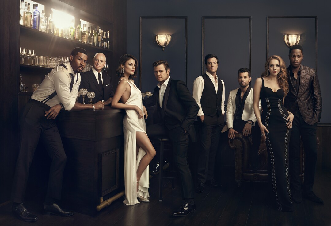 (Art Streiber/The CW) Robert Christopher Riley as Michael Culhane, Alan Dale as Joseph Anders, Nathalie Kelley as Cristal Flores, Grant Show as Blake Carrington, James Mackay as Steven Carrington, Rafael de la Fuente as Sam 'Sammy Jo' Flores, Elizabeth Gillies as Fallon Carrington and Sam Adegoke as Jeff Colby in “Dynasty.”