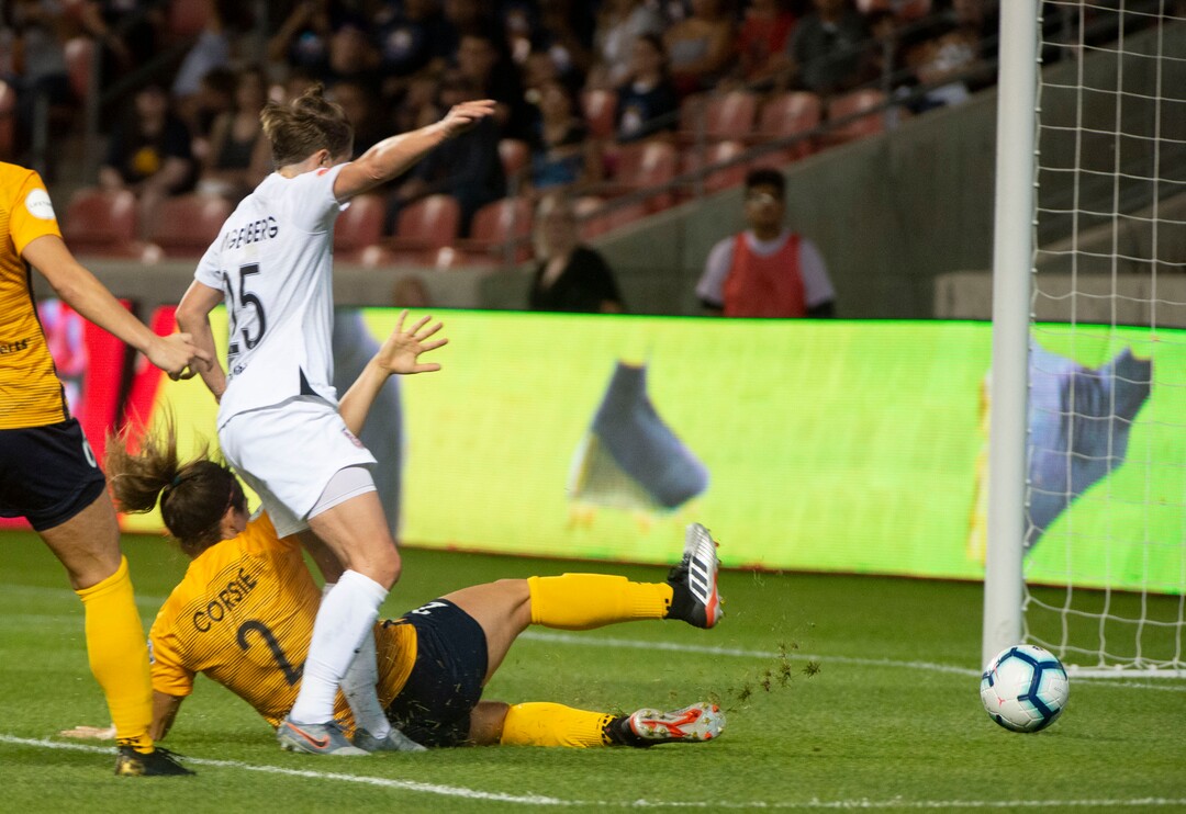 (Rick Egan  |  The Salt Lake Tribune)     Utah Royals FC defender Rachel Corsie (2) scores the game tying goal, as Portland Thorns FC defender Meghan Klingenberg (25) defends, in Soccer action between Utah Royals FC and Portland Thorns FC, in Sandy, Friday, July 19, 2019.
