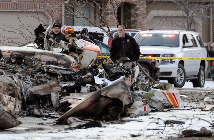 (Leah Hogsten | The Salt Lake Tribune) Weber County emergency personnel and firefighters work the scene of a small, private plane that crashed in a residential neighborhood in Roy, Jan 15, 2020. A 64-year-old pilot was killed.