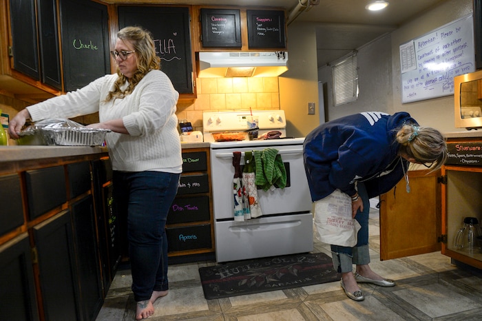 ( Leah Hogsten  |  The Salt Lake Tribune ) Left to right,  Volunteers of America Utah program manager Summer Elton and Pitece Hopkinson cook a holiday meal for the VOA home's temporary residents, December 18, 2018. The Volunteers of America Utah operates two homes in Salt Lake City to homeless young adults, many of whom were turned away by their families or aged out of foster care. Staff members help the women and men finish their education, find jobs and learn life skills so they can transition to independent living or reunify with family members.