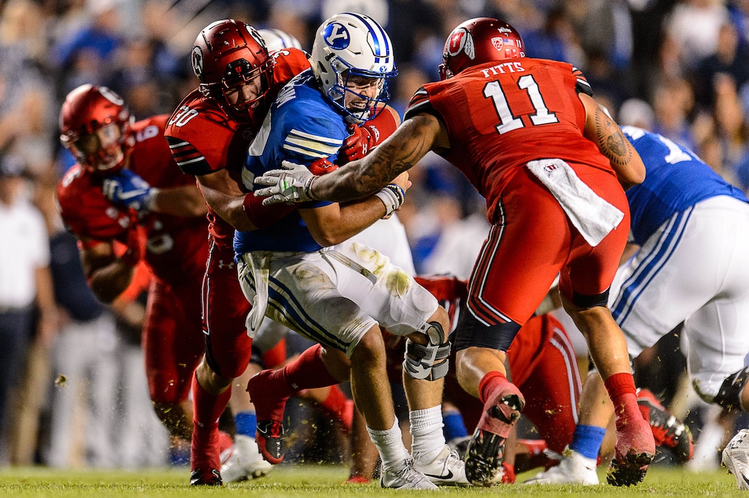 (Trent Nelson | The Salt Lake Tribune)  Utah Utes linebacker Cody Barton (30) sacks Brigham Young Cougars quarterback Tanner Mangum (12) as BYU hosts Utah, NCAA football in Provo, Saturday September 9, 2017.