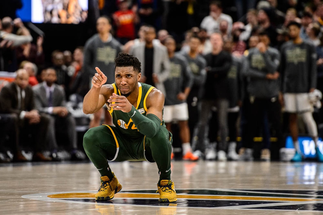 (Trent Nelson | The Salt Lake Tribune)  Utah Jazz guard Donovan Mitchell (45) celebrates as Utah Jazz forward Derrick Favors (15) makes a free throw in the final minute as the Utah Jazz host the Milwaukee Bucks, NBA basketball in Salt Lake City on Saturday March 2, 2019.