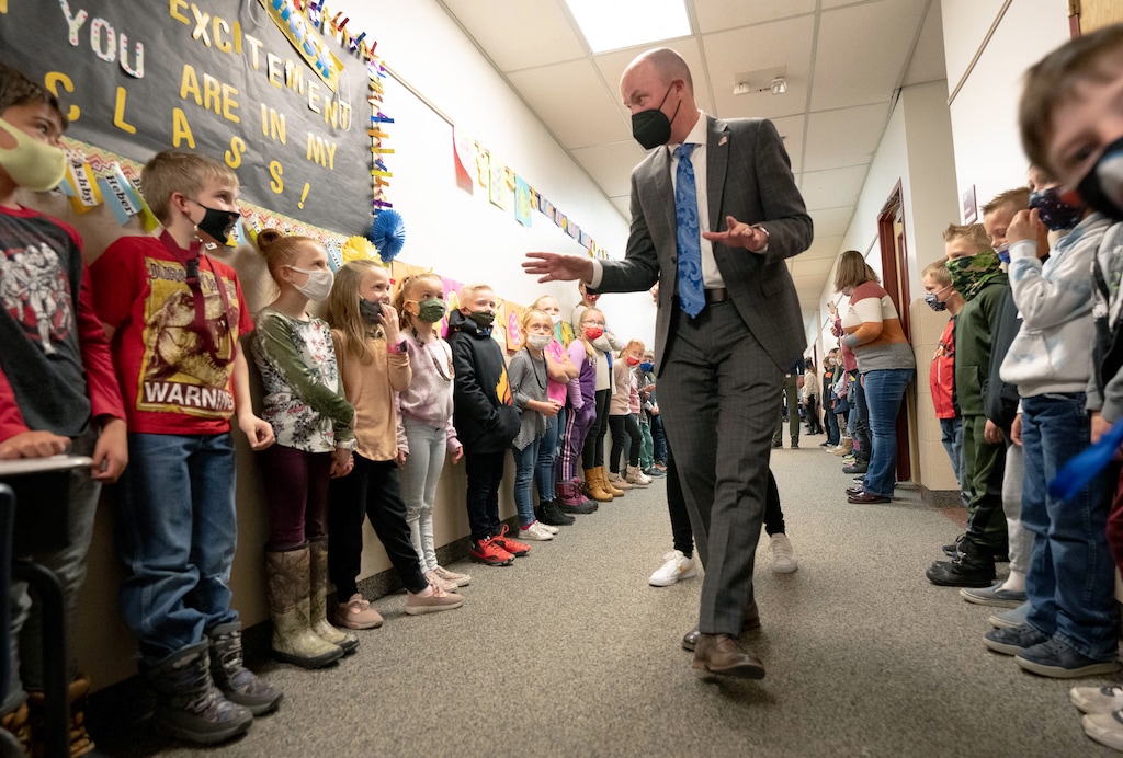 (Francisco Kjolseth  | The Salt Lake Tribune) Morgan Elementary school students line up in the halls to say hello to Gov. Spencer Cox alongside First Lady Abby Cox as they visit the Morgan School District on April 14 which marks the first 100 days of his administration. At the start of his campaign Gov. Cox set out to visit all 248 cities and towns in the state and Morgan was the first one he visited.