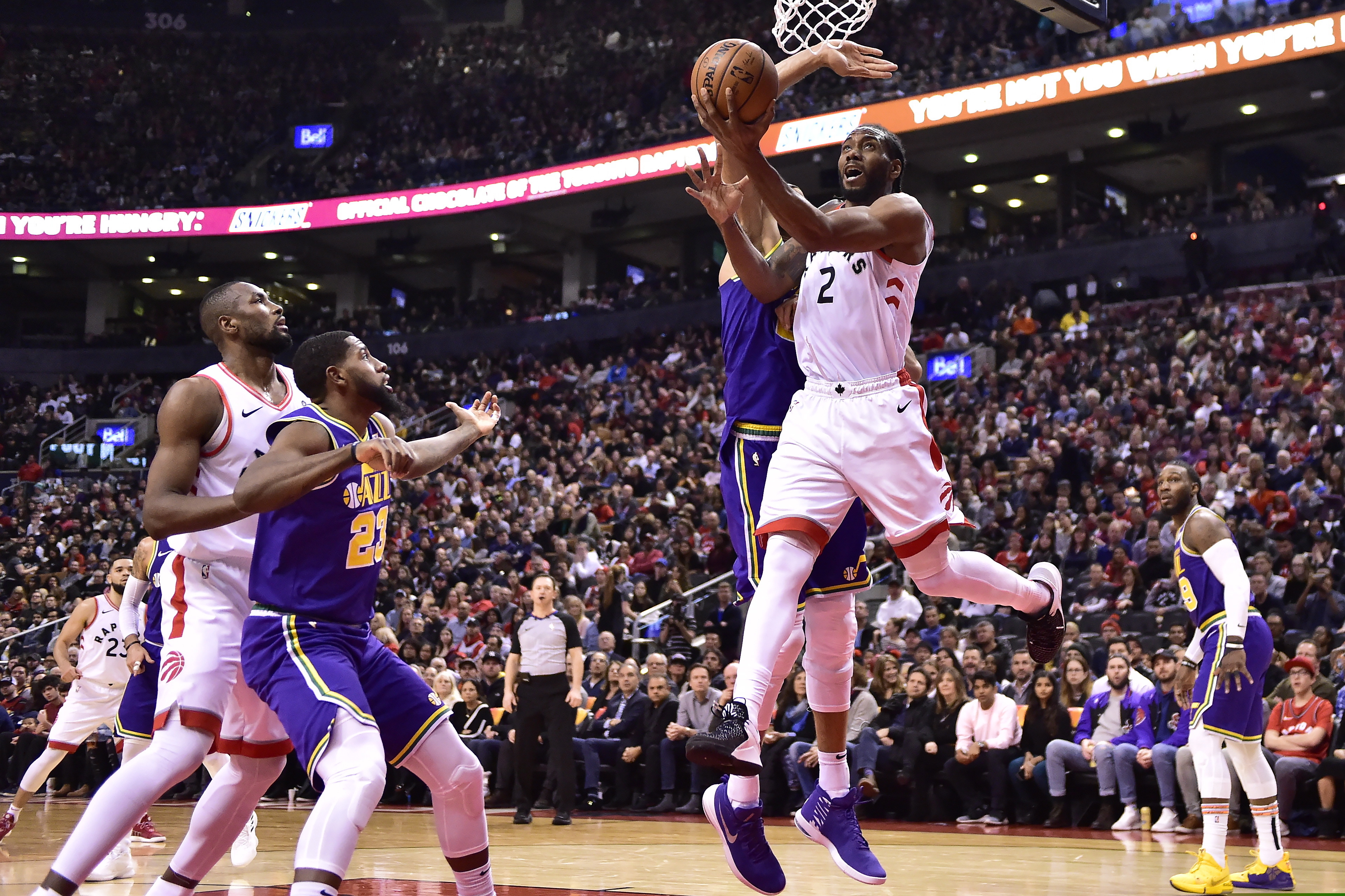 Toronto Raptors forward Kawhi Leonard (2) scores against the Utah Jazz during the second half of an NBA basketball game Tuesday, Jan. 1, 2019, in Toronto. (Frank Gunn/The Canadian Press via AP)