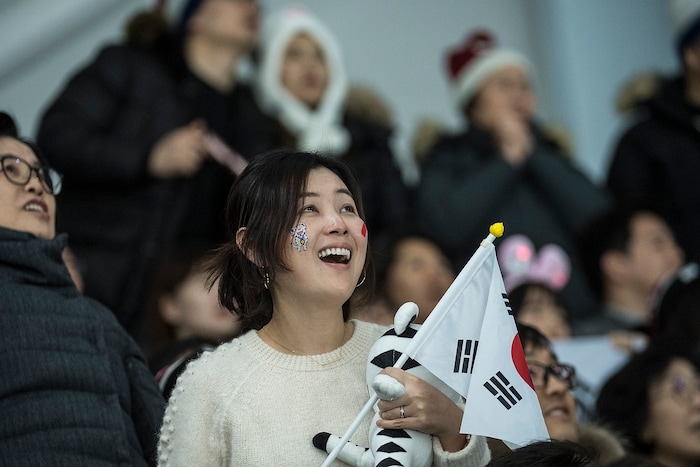 (Chris Detrick  |  The Salt Lake Tribune)  Japanese fans cheer as Nao Kodaira races in the Ladies' 500m at the Gangneung Oval during the Pyeongchang 2018 Winter Olympics Sunday, Feb. 18, 2018. Kodaira won the event with a time of 36.94.