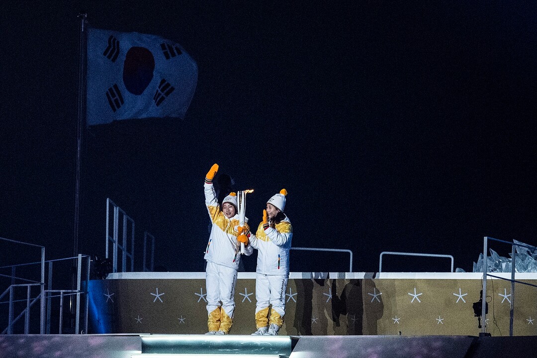 (Chris Detrick  |  The Salt Lake Tribune)  North Korea's Jong Su Hyon, left, and South Korea's Park Jong-ah carry the torch during the Pyeongchang 2018 Winter Olympics opening ceremony at Olympic Stadium Friday, February 9, 2018.  