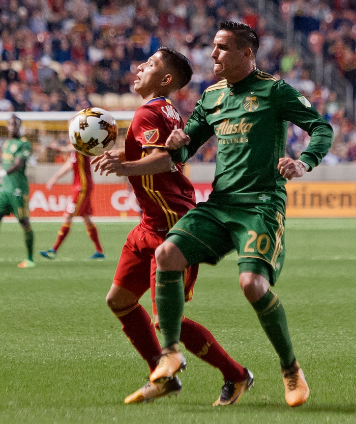 (Michael Mangum  |  Special to the Tribune)  Real Salt Lake forward Jefferson Savarino (7) chests the ball down in front of Portland Timbers midfielder David Guzman (20) during their MLS match at Rio Tinto Stadium in Sandy, UT on Saturday, September 16, 2017.