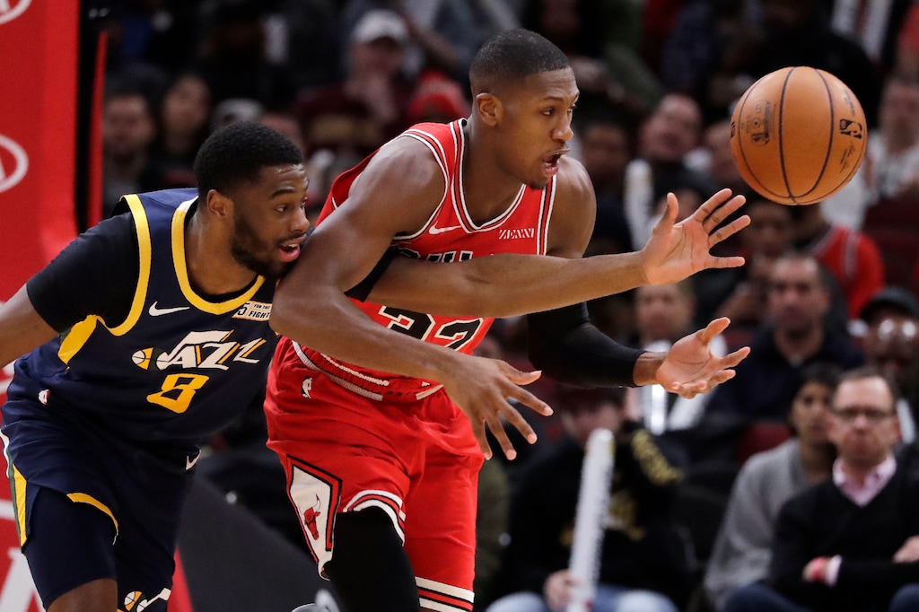 Utah Jazz guard Emmanuel Mudiay, left, and Chicago Bulls guard Kris Dunn battle for the ball during the first half of an NBA basketball game in Chicago, Thursday, Jan. 2, 2020. (AP Photo/Nam Y. Huh)