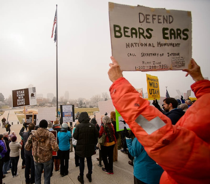(Trent Nelson | The Salt Lake Tribune) Citizens with signs at a rally on the steps of the State Capitol Building in Salt Lake City against Rep. Chris Stewart's Grand Staircase bill that would create an Escalante National Park. Tuesday December 12, 2017.