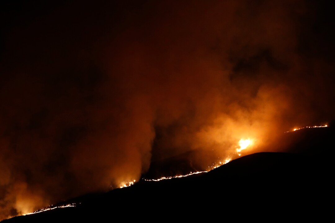 (George Frey  |  for The Salt Lake Tribune) A wildfire burns on Traverse Mountain above Lehi, Uta,h on June 28th, 2020.