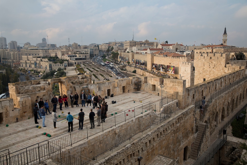 (AP Photo/Oded Balilty) Israelis play on the walls of Tower of David compound in Jerusalem, Tuesday, Dec. 5, 2017. U.S. officials say President Donald Trump will recognize Jerusalem as Israel's capital on Wednesday, Dec. 6, despite intense Arab, Muslim and European opposition to a move that would upend decades of U.S. policy and risk potentially violent protests.