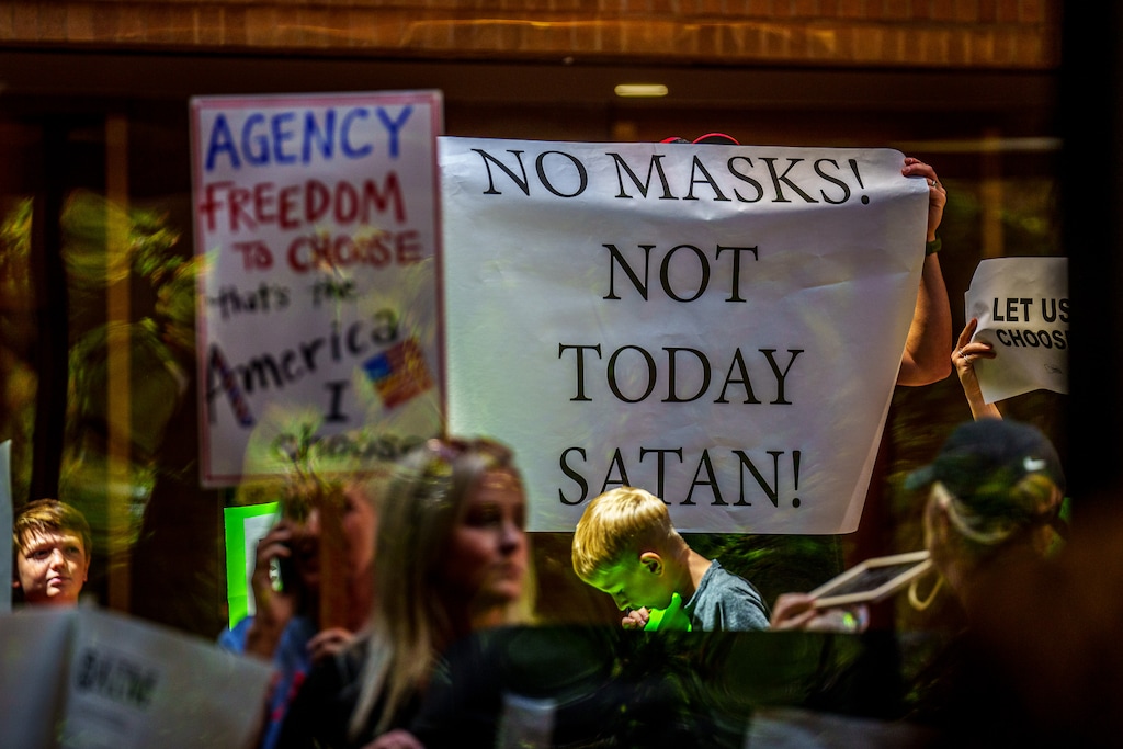 (Trent Nelson  |  The Salt Lake Tribune) People fill the room as the Salt Lake County Council voted down Dr. Angela Dunn's mask ordinance for K-6 students, on Thursday, Aug. 12, 2021.
