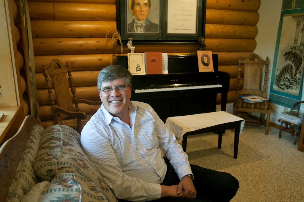 (Chris Detrick | Tribune file photo) Gaylen Rust poses for a portrait at his home in Layton Wednesday May 22, 2013. Rust, now 62, pleaded guilty Monday to federal charges of wire fraud, securities fraud and money laundering conspiracy after he was accused of soliciting investors to fund a silver trading scheme through his family's antique coin business, Rust Rare Coin.
