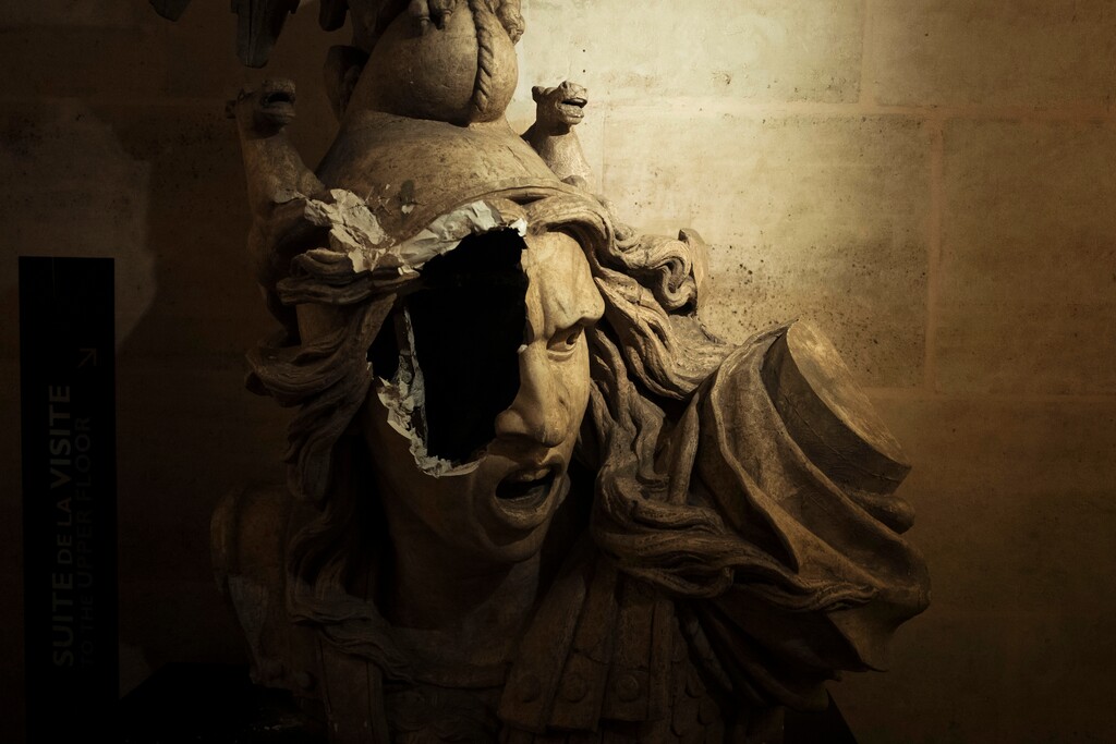 A broken sculpture of Marianne, symbol of the French Repupblic, appears damaged in the gallery inside the Arc de Triomphe during a demonstration Saturday, Dec.1, 2018 in Paris. A French protest against rising taxes and the high cost of living turned into a riot Saturday in Paris as police fired tear gas and water cannon in street battles with activists wearing the fluorescent yellow vests of a new movement. (AP Photo/Kamil Zihnioglu)