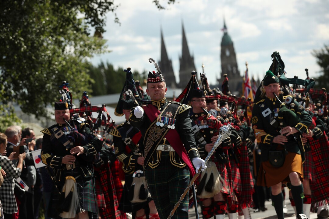 (Francisco Seco | AP) Bagpipers lead a procession of British World War II veterans to the Bayeux War Cemetery for a ceremony to mark the 75th anniversary of D-Day in Bayeux, Normandy, France, Thursday, June 6, 2019. World leaders gathered Thursday in France to mark the 75th anniversary of the D-Day landings.