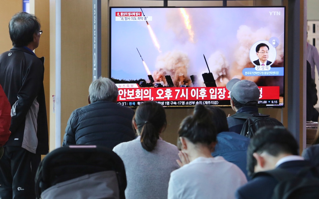 (Ahn Young-joon | AP Photo) People watch a TV showing a file photo of North Korea's weapon systems during a news program at the Seoul Railway Station in Seoul, South Korea, Thursday, May 9, 2019. North Korea on Thursday fired at least one unidentified projectile from the country's western area, South Korea's military said, the second such launch in the last five days and a possible warning that nuclear disarmament talks could be in danger. The signs read: Announcement of security meeting at 7:00 PM".