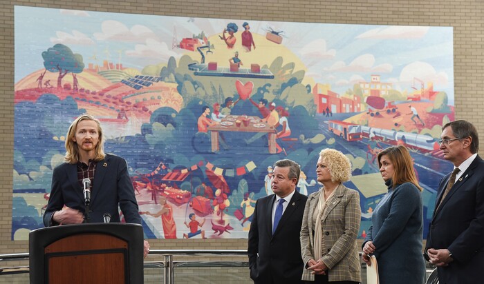 (Francisco Kjolseth  |  The Salt Lake Tribune) Mitch Dumke, left, Co-Chair, UN Civil Society Conference Youth Committee makes a few remarks during the reveal and dedication of a new legacy mural on Monday, Dec. 30, 2019, placed at the Salt Palace to commemorate the 68th United Nations Civil Society Conference which took place in Salt Lake City in August. Also in attendance, from left, were Baldomero Lago, Chief International Officer, Utah Valley University, Salt Lake City Mayor Jackie Biskupski, Salt Lake County Mayor Jenny Wilson and Franz Kolb, Director of Diplomacy and Protocol, GOED.