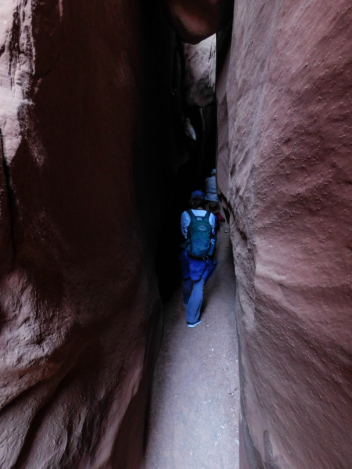 (Erin Alberty|The Salt Lake Tribune) Hikers pass through a narrow part of Leprechaun Canyon on April 29, 2017.