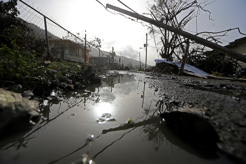 Downed power lines and debris are seen in the aftermath of Hurricane Maria in Yabucoa, Puerto Rico, Tuesday, Sept. 26, 2017. Governor Ricardo Rossello and Resident Commissioner Jennifer Gonzalez, the island’s representative in Congress, have said they intend to seek more than a billion in federal assistance and they have praised the response to the disaster by President Donald Trump, who plans to visit Puerto Rico next week, as well as FEMA Administrator Brock Long.  (AP Photo/Gerald Herbert)