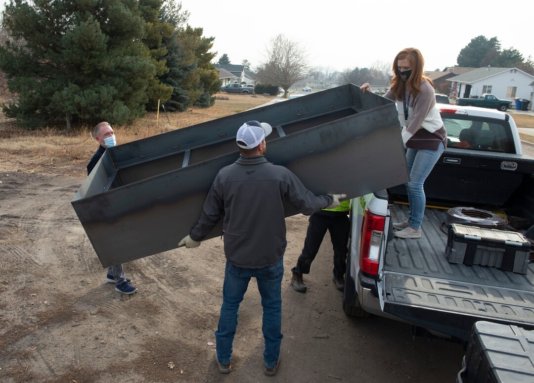 (Rick Egan | The Salt Lake Tribune)  Jennie Taylor helps upload a planter box with workers from Stratton and Brätt, a company that is redesigning and restoring the small farm owned by the Taylor family, Thursday, Dec. 10, 2020.