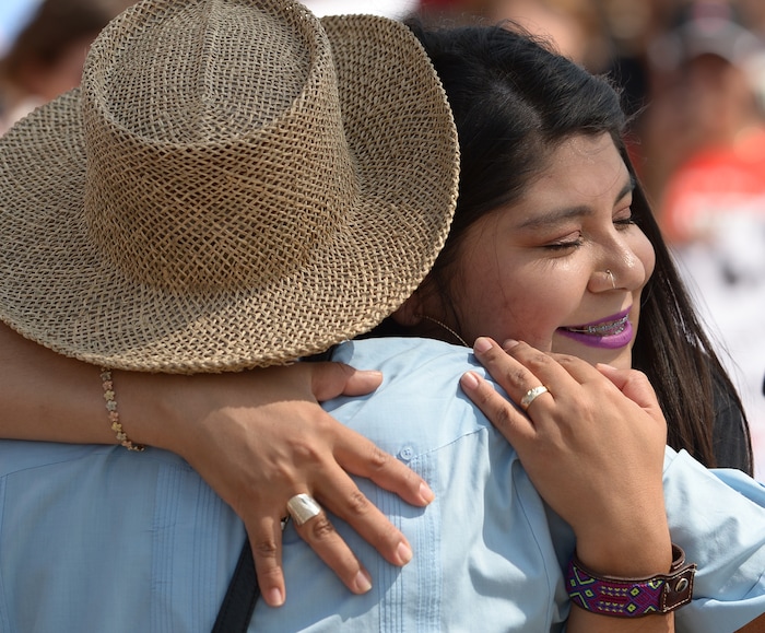 (Leah Hogsten  |  The Salt Lake Tribune) Mayra Cedano gives a hug to activist Archie Archuleta. Hundreds of "We are Dreamers," a Utah pro-Deferred Action for Childhood Arrival (DACA) group, marched in solidarity from the Utah Federal Building to the State Capitol with undocumented immigrants who will be affected by the end of DACA.