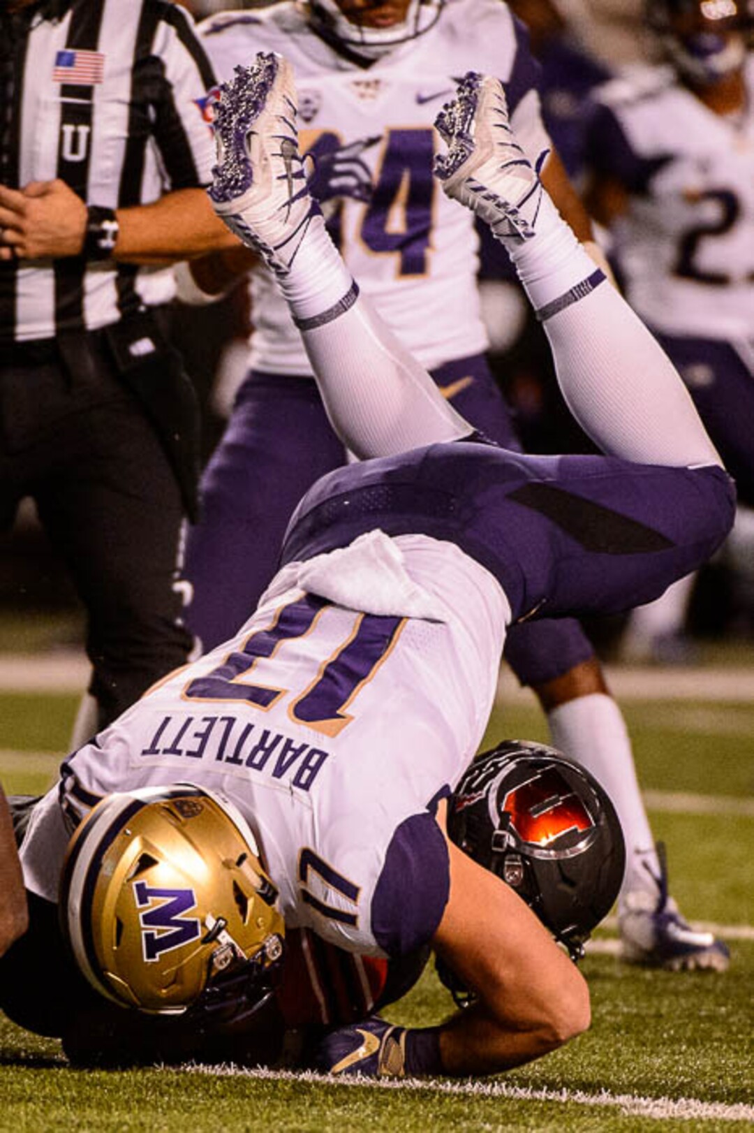 (Trent Nelson | The Salt Lake Tribune)  Washington Huskies linebacker Tevis Bartlett (17) dives on top of Utah Utes quarterback Tyler Huntley (1) as the University of Utah hosts Washington at Rice-Eccles Stadium in Salt Lake City, Saturday Sept. 15, 2018.