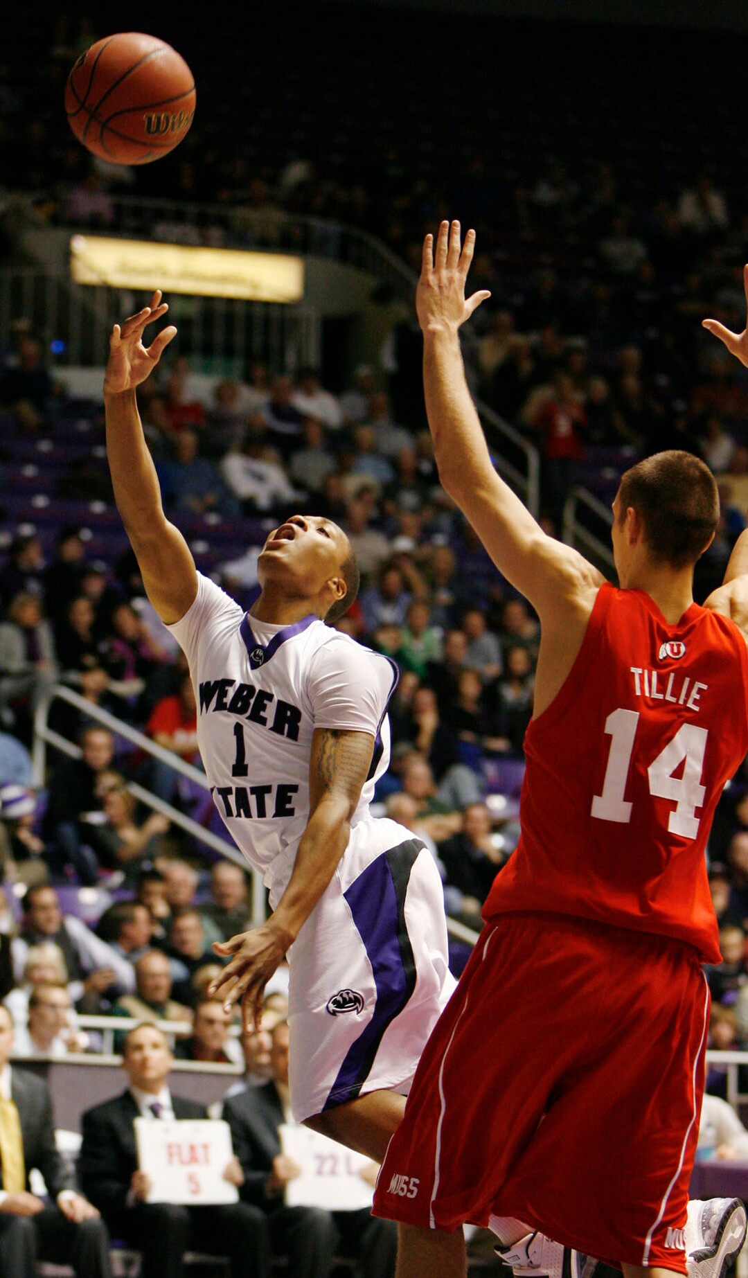 (Steve Griffin  |  Tribune file photo)  In 2009, Weber State's Damian Lillard scopes in two over Utah's Kim Tillie, who led the Utes with 20 points. But Lillard scored 28 as Weber State sent Utah back to Salt Lake City with an 83-76 loss.