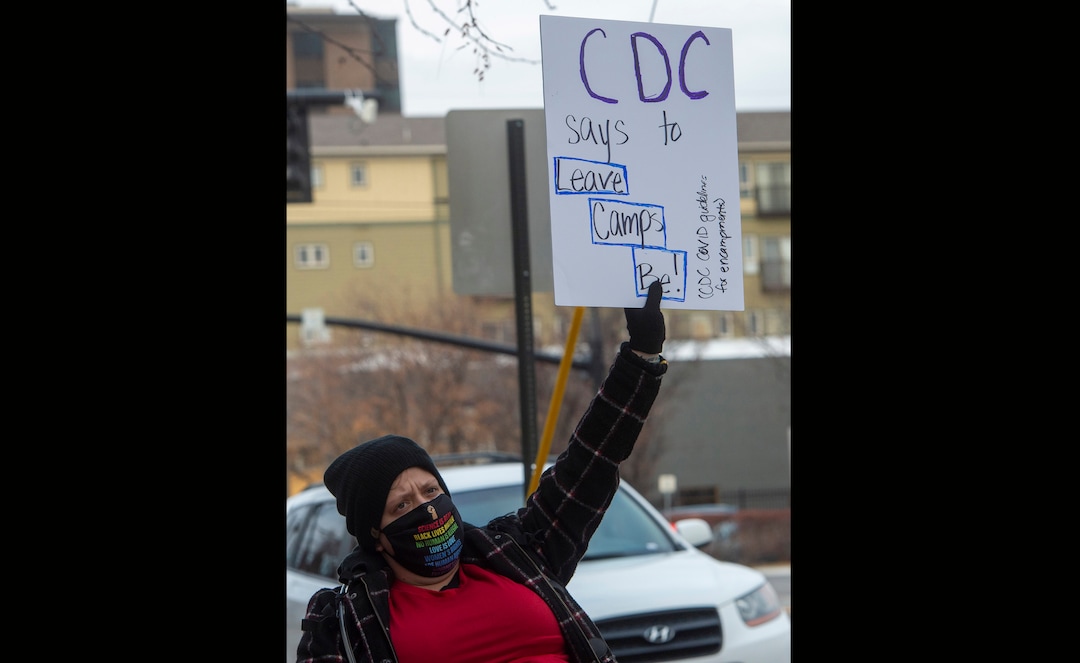 (Rick Egan | The Salt Lake Tribune) Kjersten Thayne joins more than 100 Black Lives Matter and other groups protest the way the health department has been forcing people experiencing homelessness to move in the middle of a pandemic and the coldest time of the year, in front of the Salt Lake Public Health Center onFriday, Dec. 18, 2020.