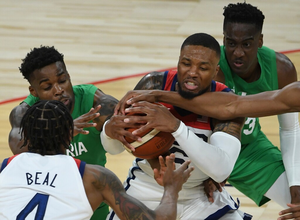 (David Becker | AP Photo) Utah Jazz forward Miye Oni (back right) and Nigeria beat the United States and Damian Lillard (6) in an exhibition basketball game Saturday, July 10, 2021, in Las Vegas.