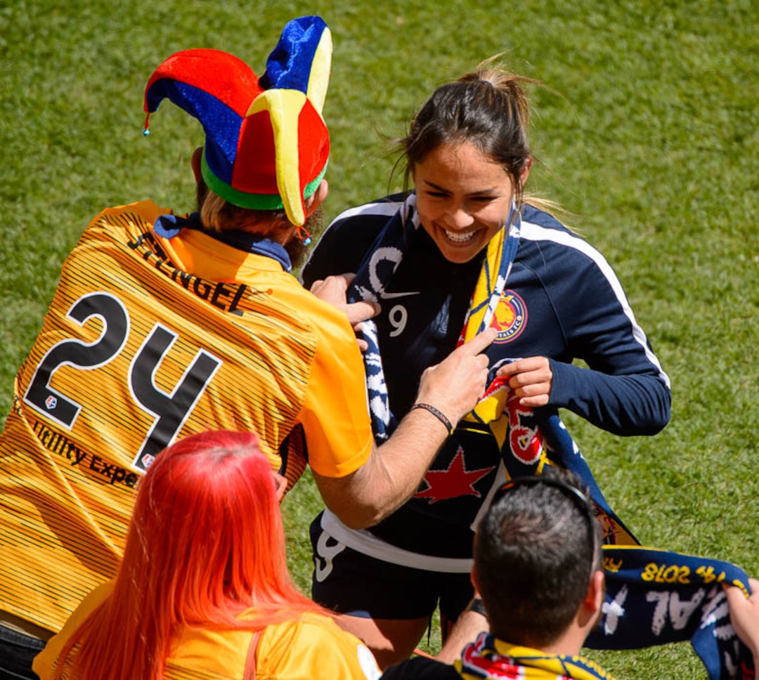 (Trent Nelson | The Salt Lake Tribune)  Utah Royals FC hosts the Chicago Red Stars, at Rio Tinto Stadium in Sandy, Saturday April 14, 2018. Players including Utah Royals FC midfielder Lo'eau LaBonta (9) are handed scarves pre-game.