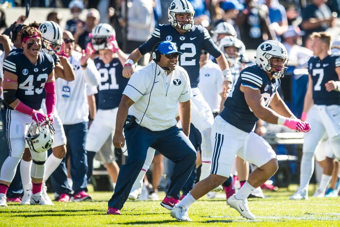 (Chris Detrick  |  The Salt Lake Tribune)  Brigham Young Cougars head coach Kalani Sitake and his players celebrate after targeting was not called on Brigham Young Cougars running back Brayden El-Bakri (35) during the game at LaVell Edwards Stadium Saturday, October 28, 2017.  