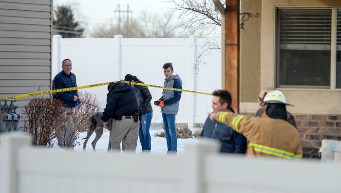 (Leah Hogsten | The Salt Lake Tribune) Weber County emergency personnel and firefighters work the scene of a small, private plane that crashed in a residential neighborhood in Roy, Jan 15, 2020. A 64-year-old pilot was killed.