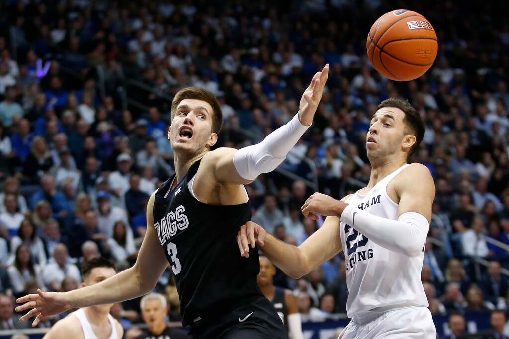 Gonzaga forward Filip Petrusev (3) and BYU forward Gavin Baxter (25) battle for a rebound in the first half during an NCAA college basketball game Saturday, Feb. 22, 2020, in Provo, Utah. (AP Photo/Rick Bowmer)