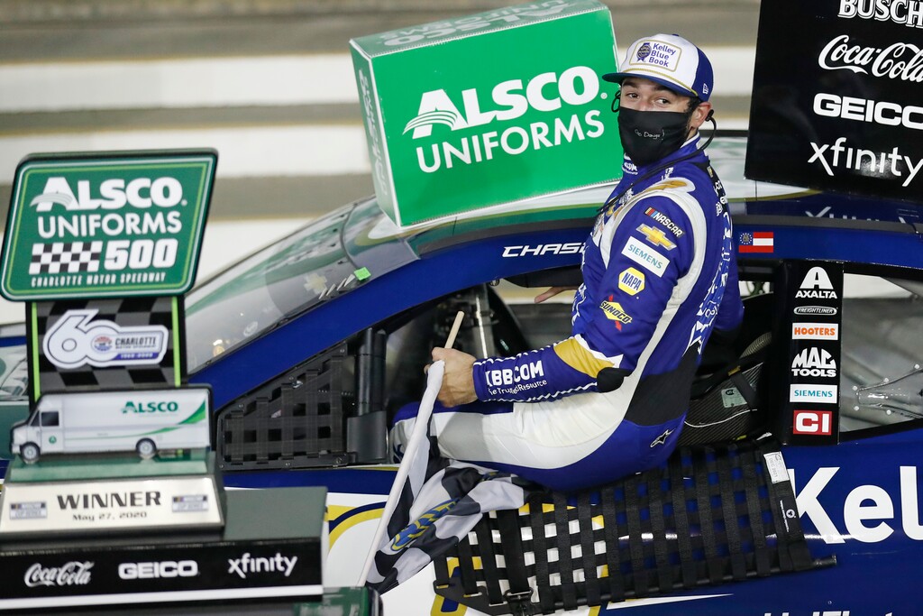 Chase Elliott gets out of his car after winning a NASCAR Cup Series auto race at Charlotte Motor Speedway Thursday, May 28, 2020, in Concord, N.C. (AP Photo/Gerry Broome)