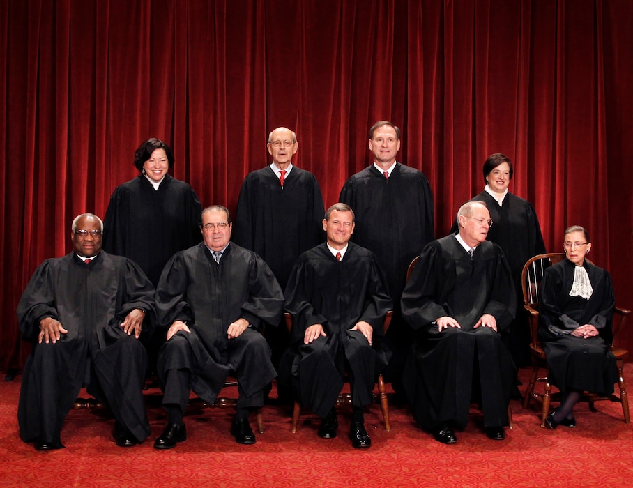 FILE - In this Oct. 8, 2010 file photo, the Supreme Court justices pose for a group photo at the Supreme Court in Washington. Seated, from left are, Justice Clarence Thomas, Antonin Scalia, Chief Justice John Roberts, Justice Anthony Kennedy, and Justice Ruth Bader Ginsburg. Standing, from left are, Justices Sonia Sotomayor, Stephen Breyer, Samuel Alito Jr., and Elena Kagan. On Saturday, Feb. 13, 2016, the U.S. Marshals Service confirmed that Scalia has died at the age of 79. (AP Photo/Pablo Martinez Monsivais, File)