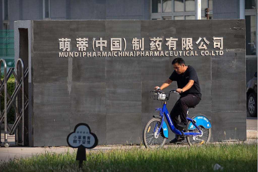 (Mark Schiefelbein | AP photo)

A man rides a bicycle past the entrance gate of a Mundipharma facility in an industrial park on the outskirts of Beijing, China on Sept. 27, 2019.