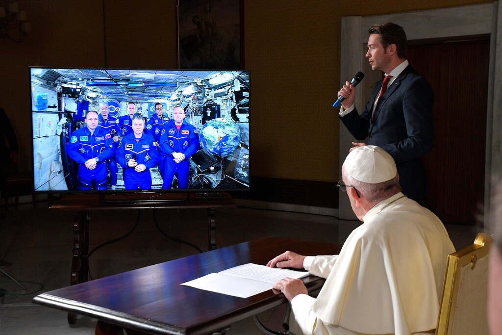 (L'Osservatore Romano  |  Pool Photo via AP)  Pope Francis connects to the crew aboard the International Space Station from the Vatican, Thursday, Oct. 26, 2017. Pope Francis' hookup Thursday will mark the second papal phone call to space: Pope Benedict XVI rang the space station in 2011, and peppered its residents with questions about the future of the planet and the environmental risks it faced.